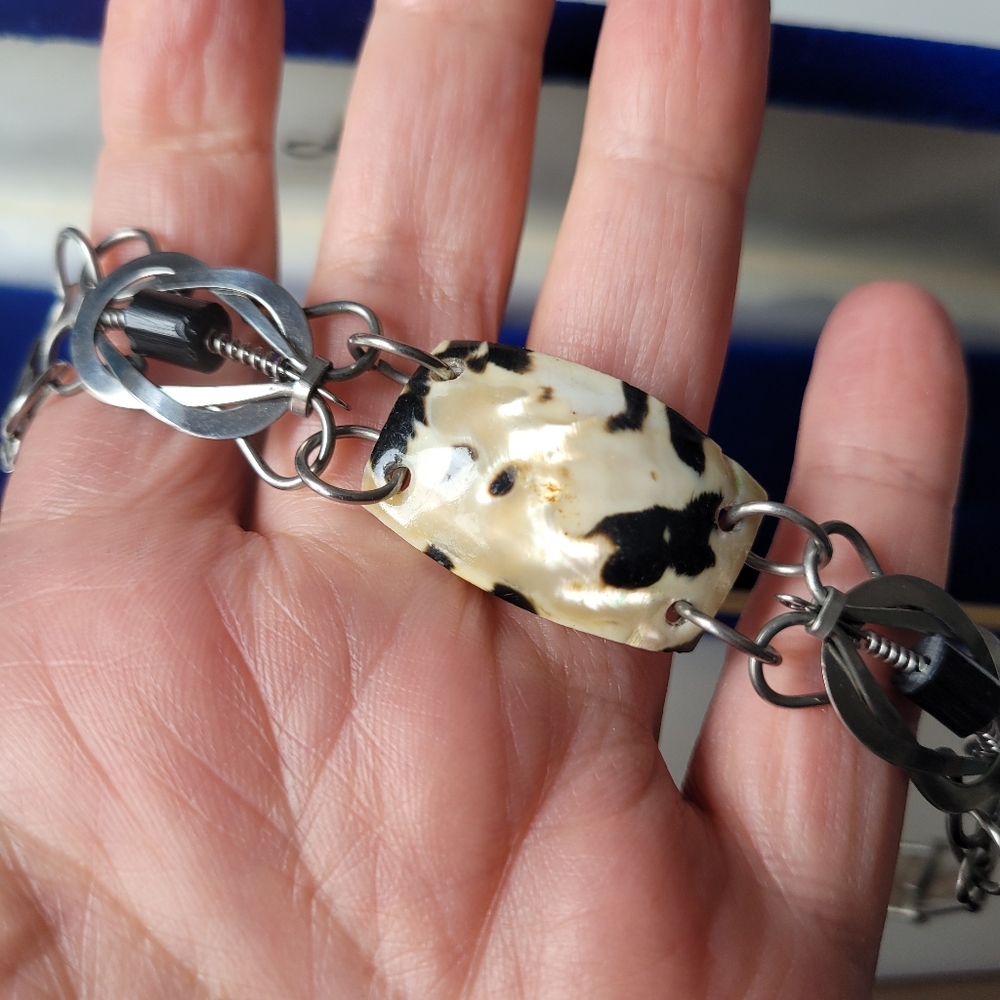 Silver tone bracelet with shells